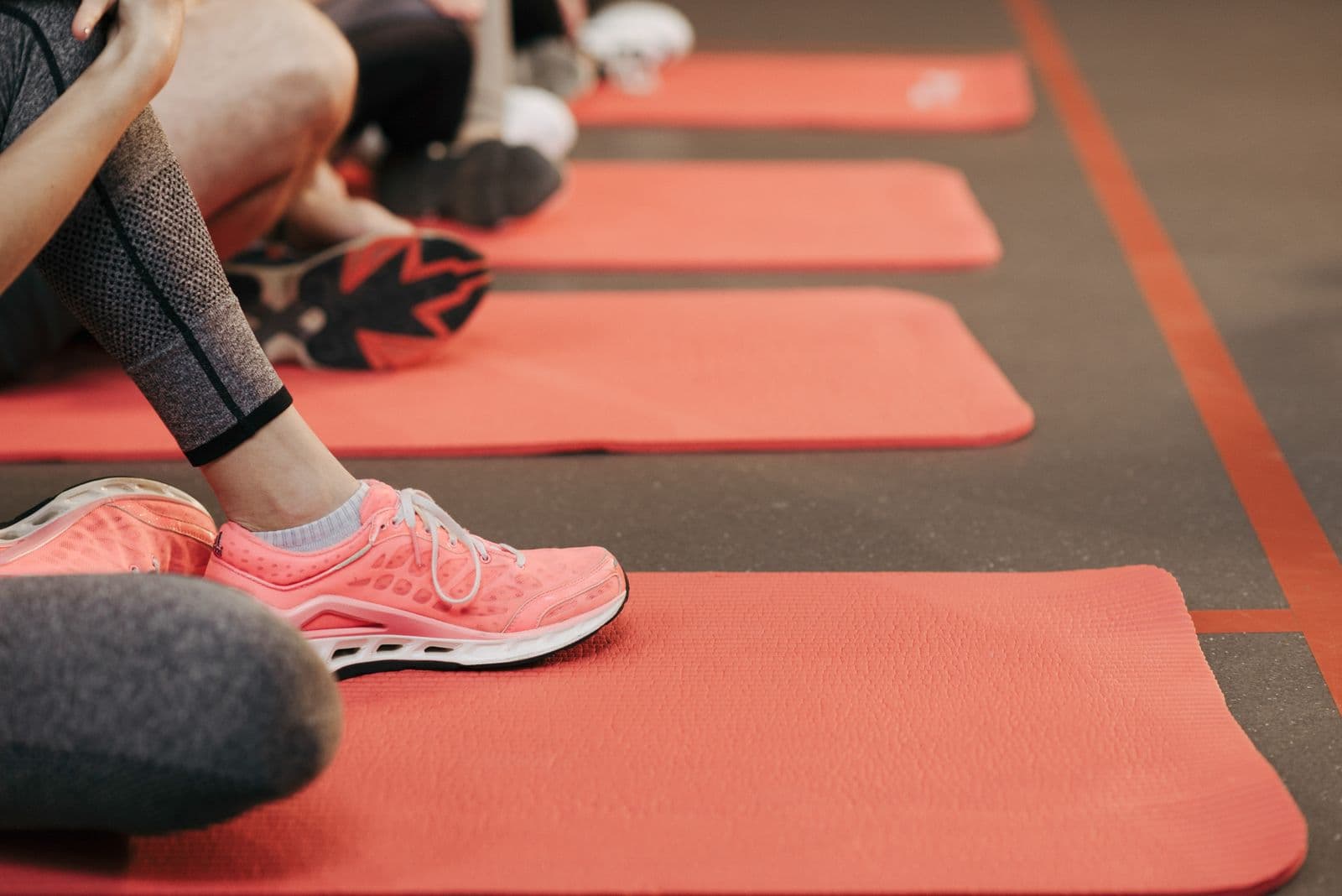 Group fitness training class with mats laid out in the AMP Fitness studio in Mesa, AZ.